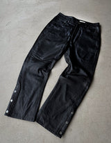 Leather pants with side slit and button closure